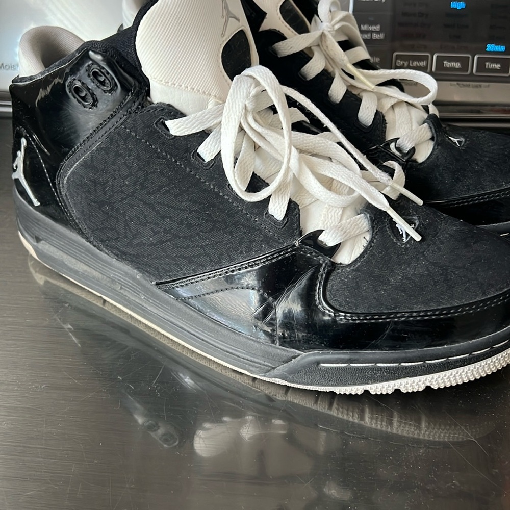Black patent and white Nike Jordans
